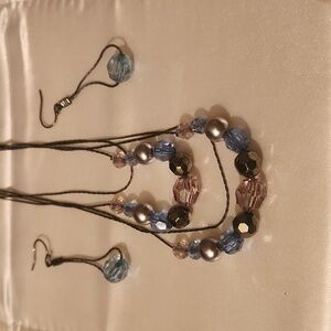 Blue and silver necklace and matching earrings.